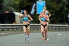 Gemma Steel and Jo Pavey has a drink while taking part in the 2012 BUPA GNR.